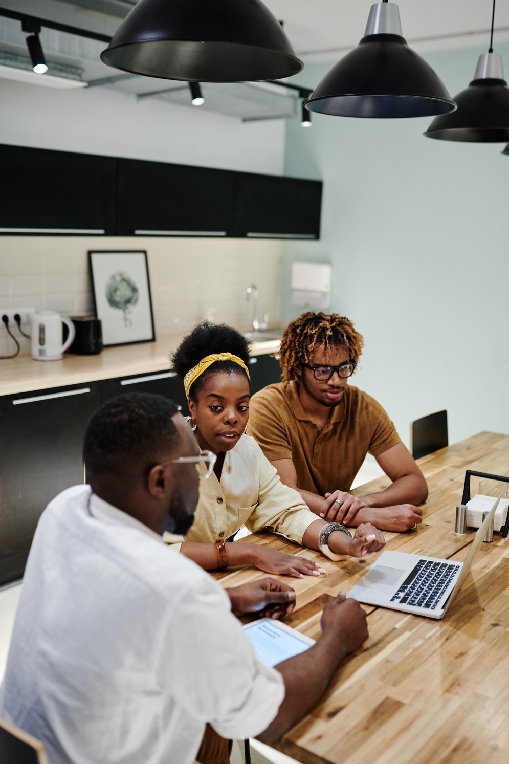 People Sitting on Wooden Dining Table